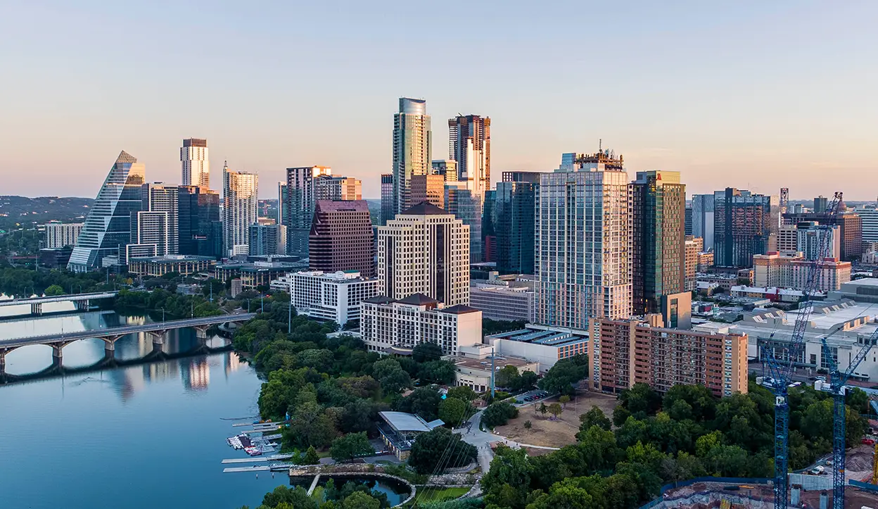 Downtown Austin, Texas skyline at dusk along the Colorado River
